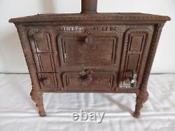 ANCIEN JOUET Gazinière Cuisinière en FONTE GODIN & Cie Bte S. G. D. G. Début XXème