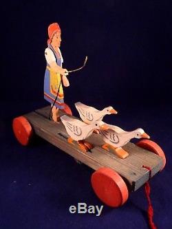 Ancien jouet animé à tirer meneuse d'oies en bois style Caran d'Ache 1930