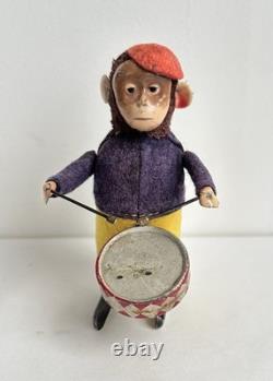 Ancien jouet mécanique automate tôle singe musicien tambour Shuco Germany 1930