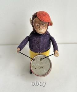 Ancien jouet mécanique automate tôle singe musicien tambour Shuco Germany 1930