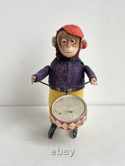 Ancien jouet mécanique automate tôle singe musicien tambour Shuco Germany 1930