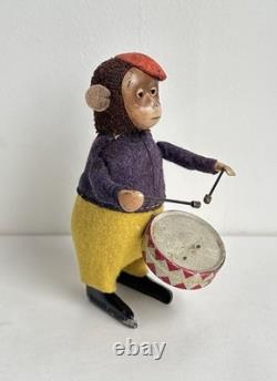 Ancien jouet mécanique automate tôle singe musicien tambour Shuco Germany 1930