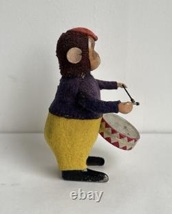 Ancien jouet mécanique automate tôle singe musicien tambour Shuco Germany 1930