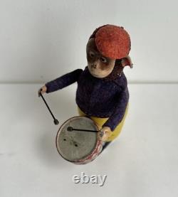 Ancien jouet mécanique automate tôle singe musicien tambour Shuco Germany 1930