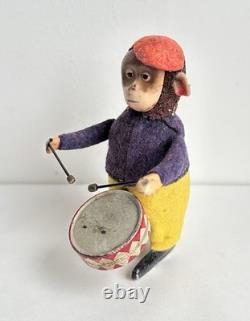 Ancien jouet mécanique automate tôle singe musicien tambour Shuco Germany 1930