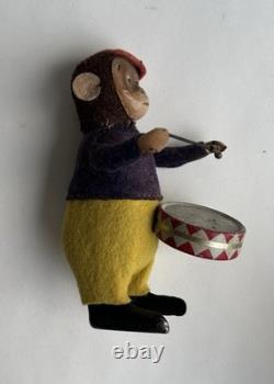 Ancien jouet mécanique automate tôle singe musicien tambour Shuco Germany 1930