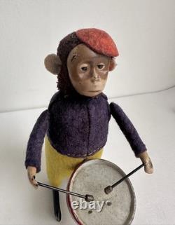 Ancien jouet mécanique automate tôle singe musicien tambour Shuco Germany 1930