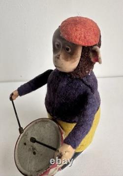 Ancien jouet mécanique automate tôle singe musicien tambour Shuco Germany 1930