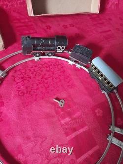 Ancien petit train en tôle avec circuit et boite d'origine distler germany
