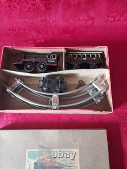 Ancien petit train en tôle avec circuit et boite d'origine distler germany