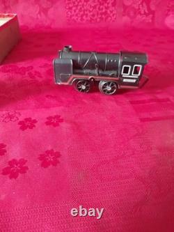 Ancien petit train en tôle avec circuit et boite d'origine distler germany