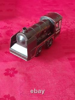 Ancien petit train en tôle avec circuit et boite d'origine distler germany