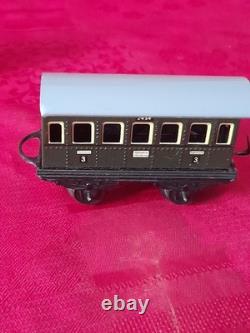 Ancien petit train en tôle avec circuit et boite d'origine distler germany