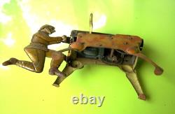 Homme a la mitrailleuse jouet mecanique en tole (1940) Gunthermann
