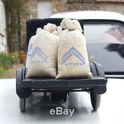 Jouet Citroën tôle C4 plateau avec chargement de sacs