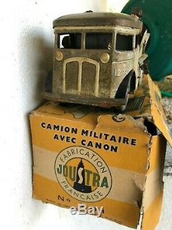 Jouet ancien JOUSTRA camion militaire avec canon et sa boite