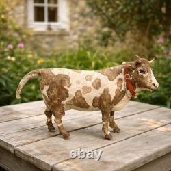 Jouet ancien mécanique Vache à lait sur roulettes, fin XIXe siècle