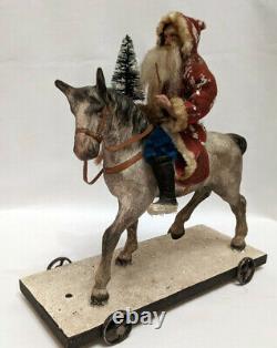 Rarissine Pere Noel ancien sur son cheval jouet a tirer Santa Claus on horse