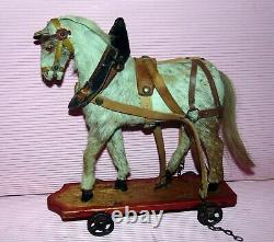 Superbe petit cheval en peau jouet Victorien c1880 sur roues de fonte PRIX R